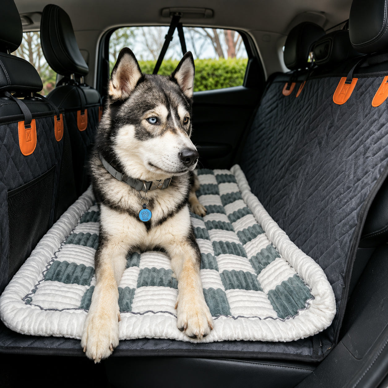 Dog resting on the Luxe Dog Bed, seen from the car door